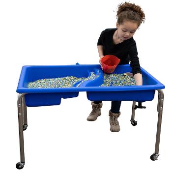 The double-basin 24″ Sensory Bin Children’s Factory blue Neptune Table is a great way to let children explore the properties of water and sand without making a big mess.